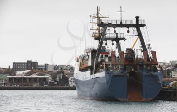 Industrial trawler ship stands moored in port of Reykjavik, Iceland. Stern view