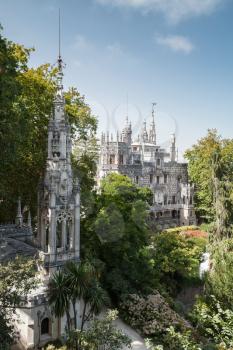 Romantic palace and chapel of Quinta da Regaleira. Sintra, Portugal. It was completed in 1910 and now is classified as a World Heritage Site by UNESCO. Vertical photo