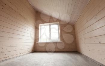 Empty new room interior, wooden walls and bright light window