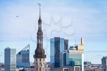 Cityscape panorama of Tallinn, Estonia. Modern buildings and old tower