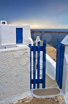 Wicket gate and build in typical Santorini colors
