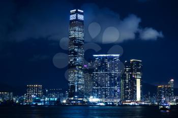 Cityscape of Hong Kong at night, illuminated skyscrapers of Kowloon district