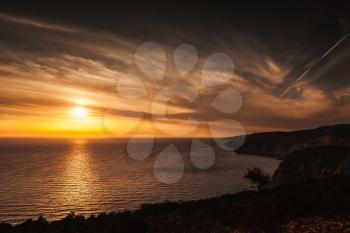 Colorful dramatic sunset. Landscape of Cape Keri in Greek island Zakynthos, Ionian Sea