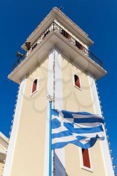 Holy Church of Zoodochos Pigi. Exterior with Greek flag in summer day. Zakynthos island, Greece