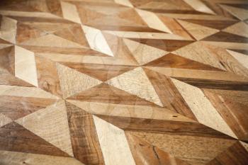 Classic wooden parquet flooring design, geometric pattern. Background photo texture