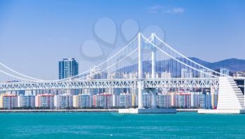 Cityscape with Gwangandaegyo or Diamond Bridge, suspension bridge located in Busan, South Korea