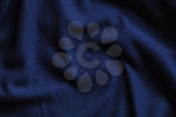 Texture of fleece, deep blue soft napped insulating fabric made of polyester, wavy pattern