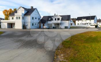 White wooden houses of Kyrksaeterora town. Rural Norwegian landscape at autumn day