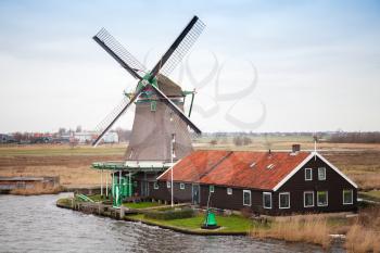 Windmill in Zaanse Schans historic town, Holland. It is one of the most popular tourist attractions of the Netherlands