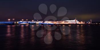 Night panorama of the Neva River. Old Saint Petersburg Stock Exchange and Rostral Columns, Russia 