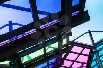 Colorful transparent roof made of glass and steel framing, abstract architecture fragment
