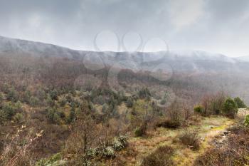 Mountain landscape in fog and clouds at spring day, natural background photo of Crimea