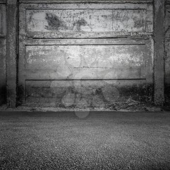 Grungy gray concrete wall and asphalt ground, abstract empty interior background, photo texture