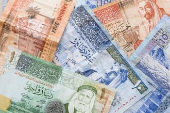 Jordanian dinars, banknotes with kings portraits, background photo