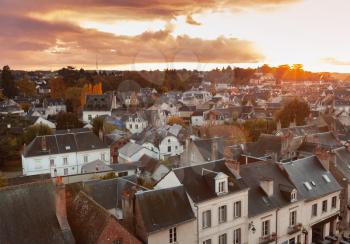 Aerial evening cityscape of Amboise town located in the Indre-et-Loire department of the Loire Valley in France. Traditional old French living houses