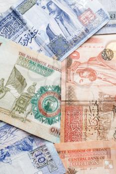 Jordanian dinars, banknotes with kings portraits, vertical background photo
