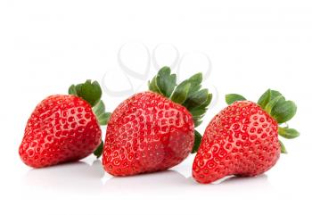 Three fresh strawberries isolated on white