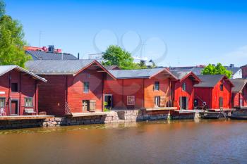 Historical Finnish town Porvoo. Red wooden houses and barns on the river coast