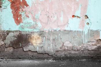 Abstract empty abandoned urban interior fragment, old colorful wall and asphalt road