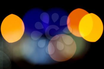 Abstract photo background with colorful lights bokeh pattern on black