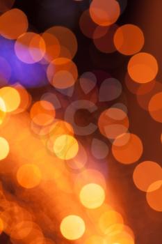 Abstract background with orange lights bokeh
