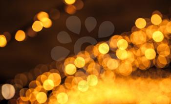 Abstract blurred background with orange lights bokeh