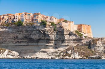 Living houses and fortress on rocky coast of Bonifacio, mountainous Mediterranean island Corsica, Corse-du-Sud, France