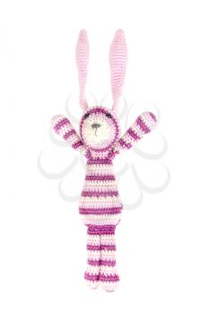 Funny knitted rabbit toy is jumping, isolated on white background