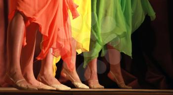 Bright fragment of modern dance show with colorful girls waved skirt