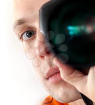Closeup man photographer self-portrait with camera