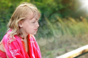 Outdoor summer portrait of Little blond girl in red shawl