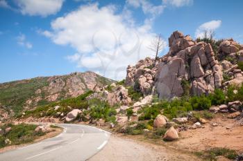Turning mountain road, empty landscape of Corsica, France. Porto Vecchio region