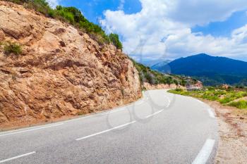 Turn of a mountain road, landscape of Corsica, France. Porto Vecchio region