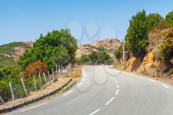 Turning mountain highway, road landscape of Corsica, France. Porto Vecchio region
