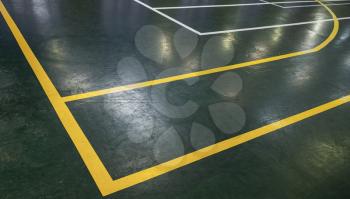 Green floor of sports hall with marking lines