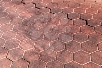Red honeycomb cobblestone pattern, street pavement background texture