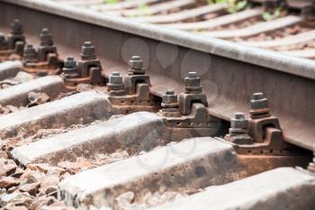 Modern railway track details, closeup photo with selective focus