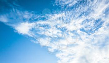Blue sky with white altocumulus clouds, natural background photo texture