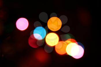 Vibrant blurred lights, bokeh optical effect. Abstract photo background