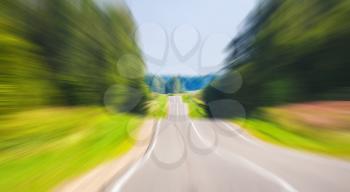 Empty rural highway perspective in summer day, European road landscape with motion blue effect