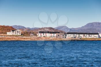 Small living houses stand on sea coast in Norway, Brekstad