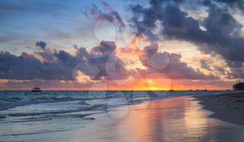 Colorful sunrise over Atlantic Ocean coast, Bavaro beach, Hispaniola Island. Dominican Republic, coastal landscape