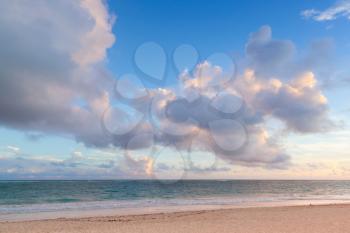 Atlantic ocean coast. Landscape with dramatic cloudy sky in sunrise, Dominican republic. Punta Cana. Bavaro beach