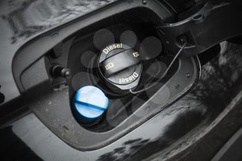 Modern car details, closed fuel cap with Diesel text marking