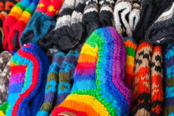 Colorful woolen socks lay on the market counter in Amsterdam