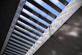 Modern white bridge structure under blue sky