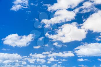 White cumulus clouds in blue sky, natural photo background