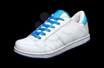 White sport shoe isolated on black background