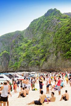 PHI-PHI ISLAND, THAILAND - JANUARY 01: Many people on the beach on New Year holidays, 01 January, 2013, Phi-Phi Island, Thailand. Tour to Phi-Phi island is one of the most popular in Thailand.  