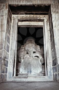 Indian god sculpture at Kadalekalu Ganesha Temple at the Sacred Center around Hampi, Karnataka, India